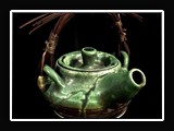 C022.  Wheel thrown teapot, with reed handle.