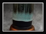 Glaze App J.  J. Matte Black (O) (SG146); Seamist (E) (SG160) 2/3; Float Blue (C) (SG152) 1/3; Splotchy on bottom shelf.