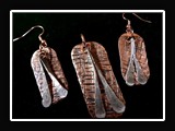M017.  Hammered copper necklace and earring set.