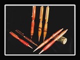 X030.  A collection of turned wooden pens using a variety of woods--maple, cedar, walnut, cherry.